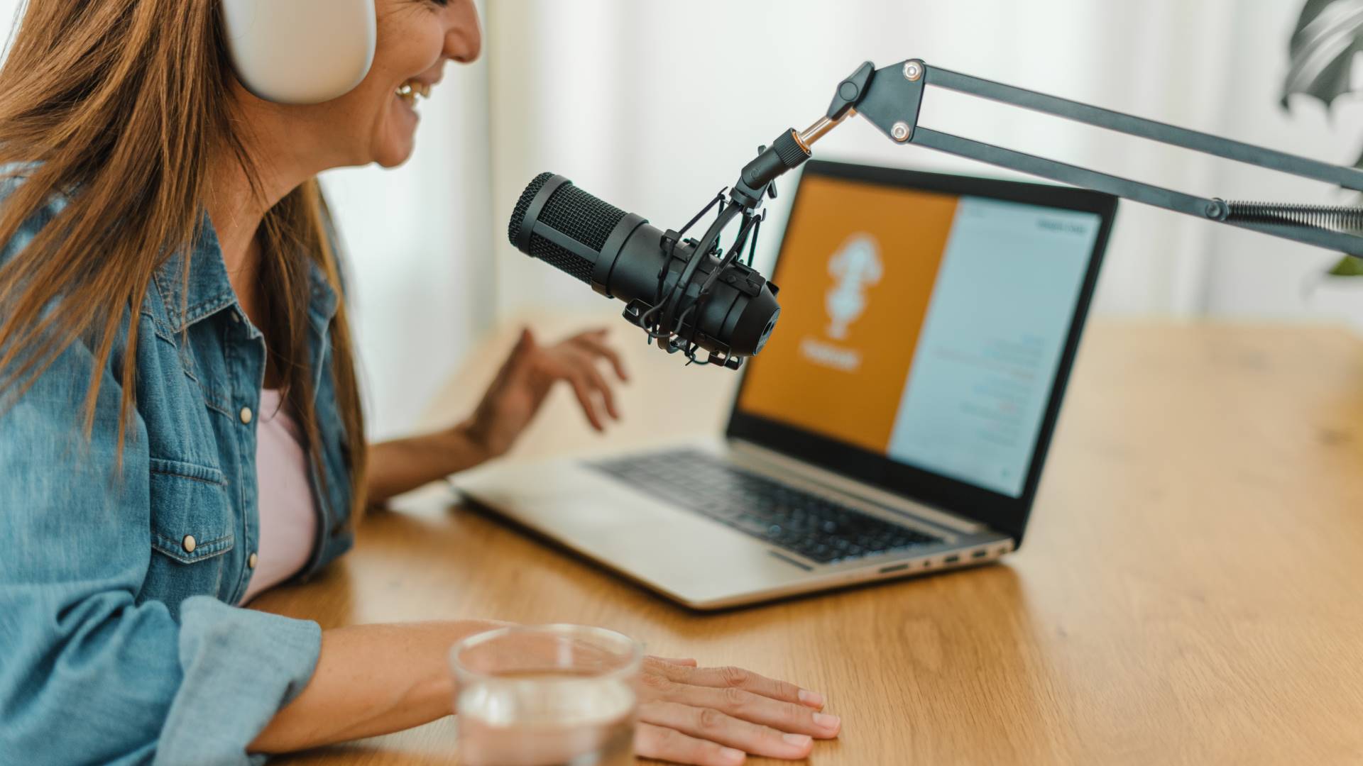 woman-in-headphones-recording-podcast-2022-09-30-16-40-14-utc